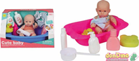 Bebe con bañera y accesorios
